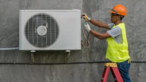 Technician is checking air conditioner - Big Easy AC Heating