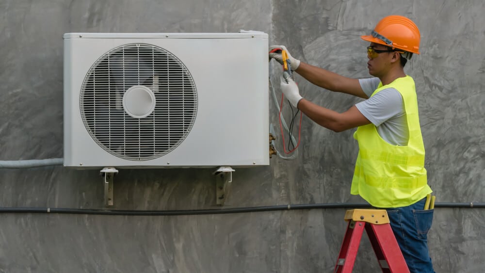 Technician is checking air conditioner - Big Easy AC Heating