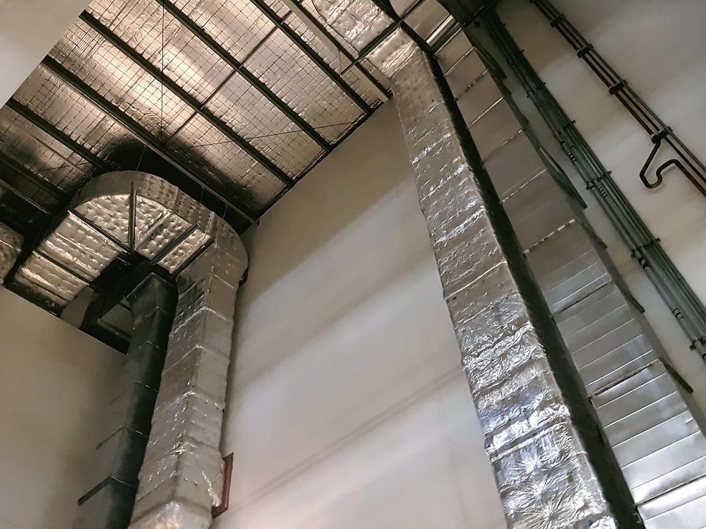 Insulated air ducts and piping of an air conditioning system in a New Orleans area home